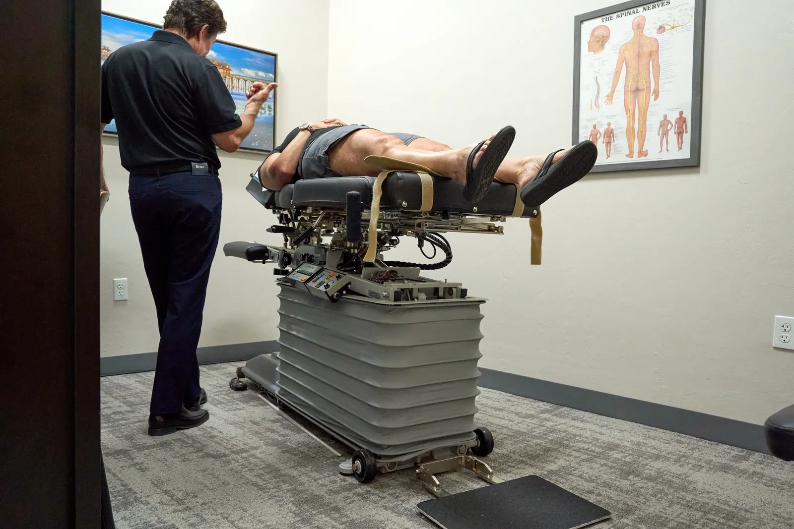 Dr. Ivan presenting treatment rooms at Novar&eacute; Injury Care